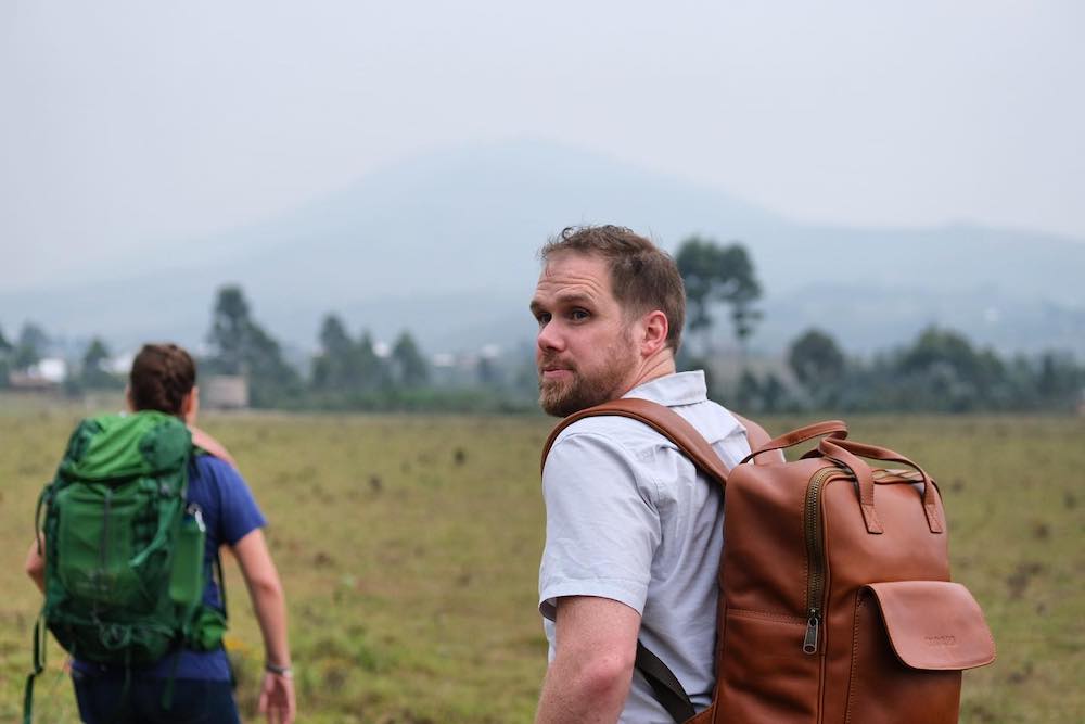 Charles Davidson hiking outdoors with backpack