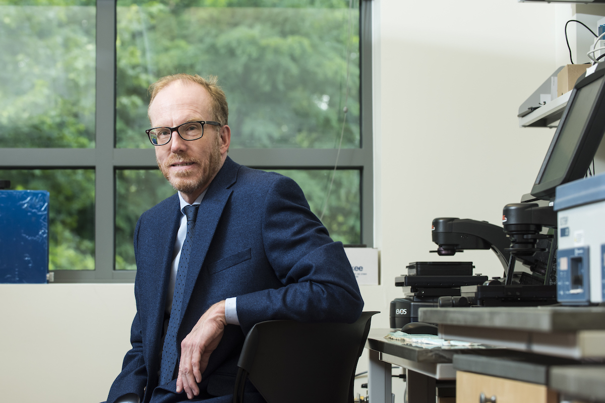 Buschmann in a sportcoat in a lab