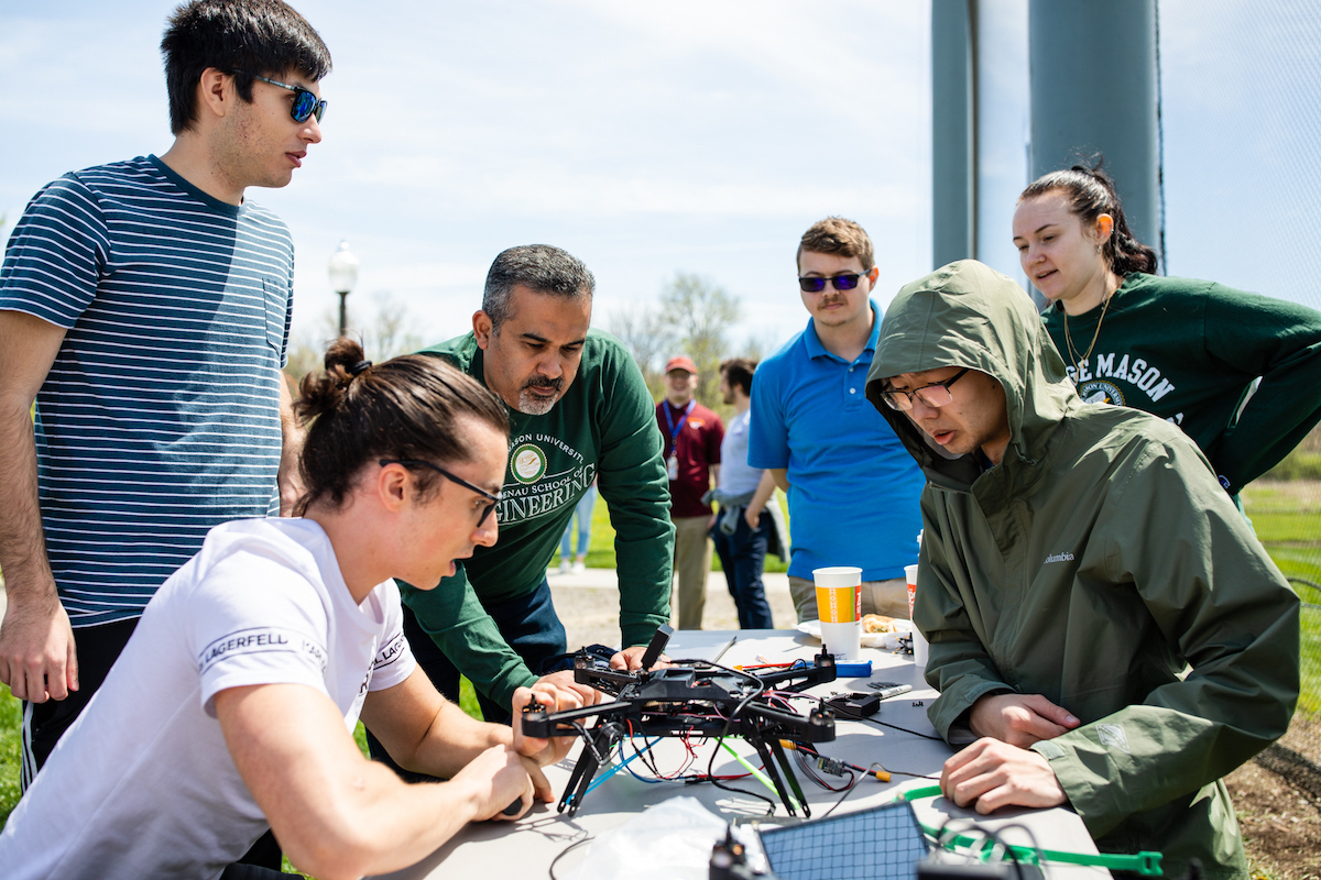 group outside around a drone