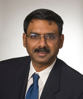 headshot of a man with glasses