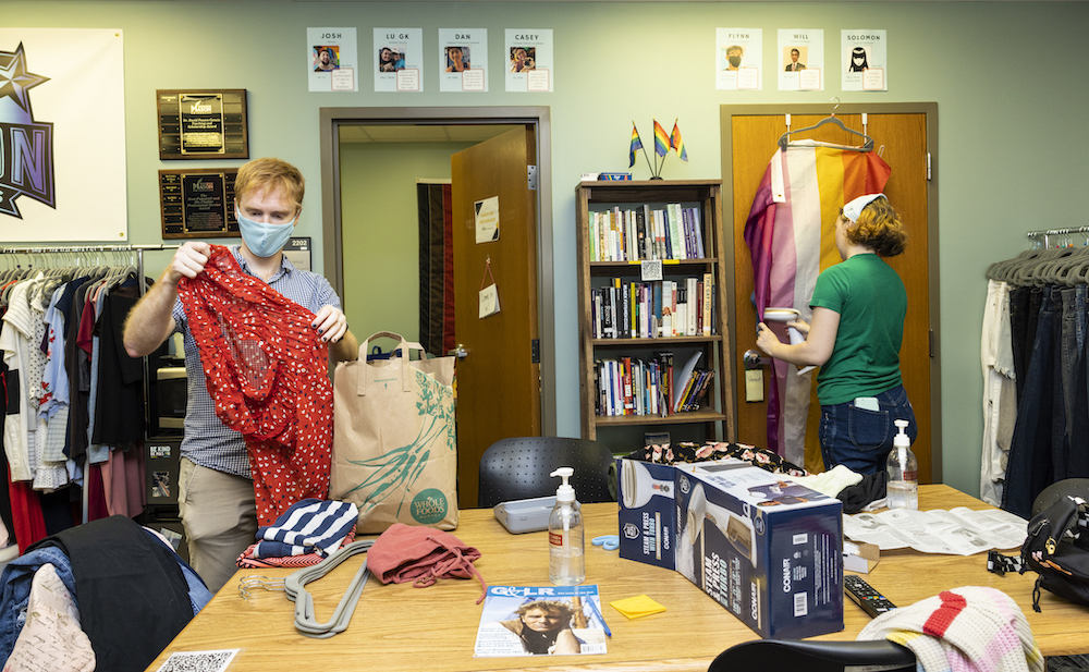 two people working with clothing