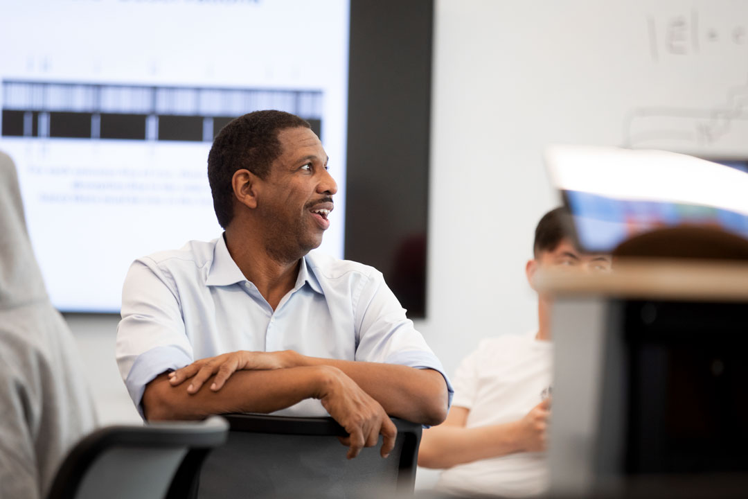 Robinson Professor Hakeem Oluseyi lecturing George Mason University students