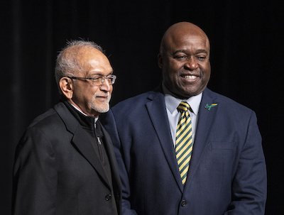 two men on stage at U Day
