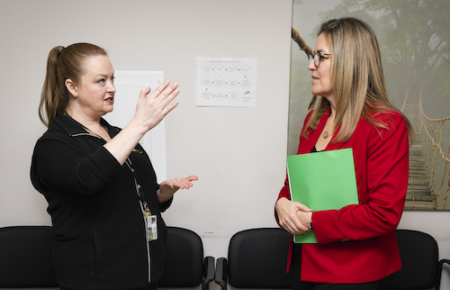 Mason faculty member Rebecca Sutter (left) talking with Representative Jennifer Wexton