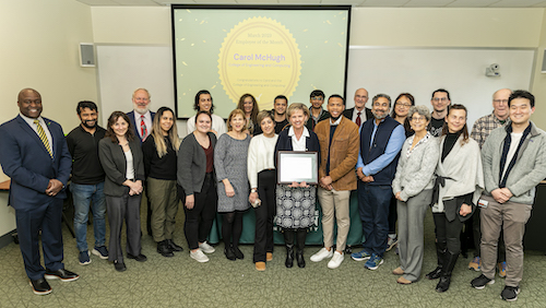 EOTM ceremony with a large group of people