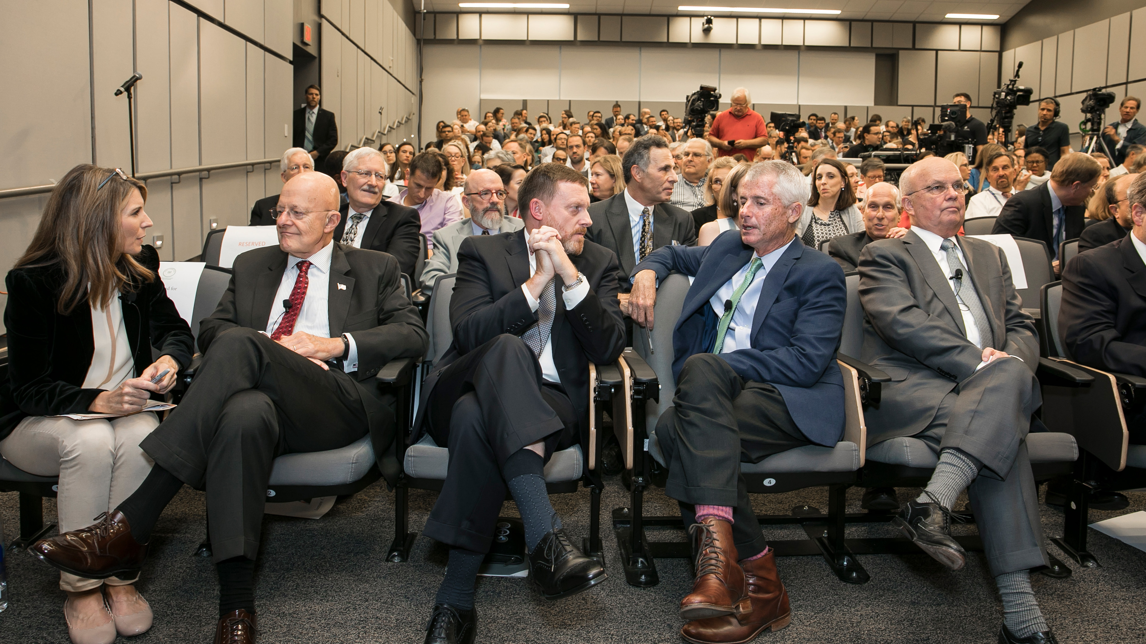 People sitting in chairs in the audience.