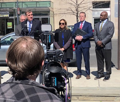 warner speaking at FBI headquarters meeting