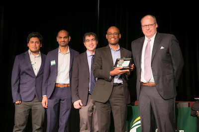 Buschman's team accepts the Innovator of the Year award