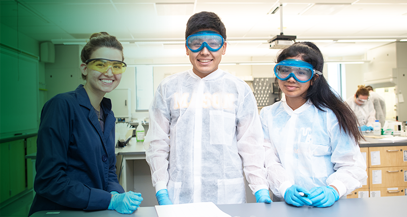 Young students work together in a lab with their supervisor.