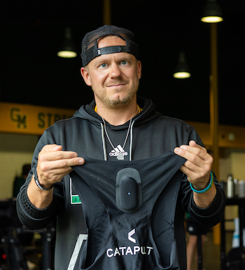 Trainer Corey Dulak-Sigler with Catapult device