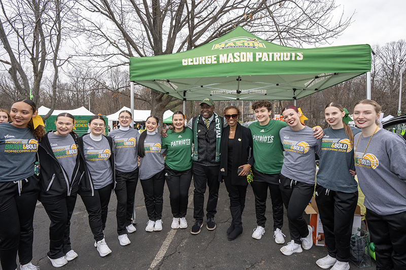 President Gregory Washington, Nicole Washington, alumni and cheerleaders