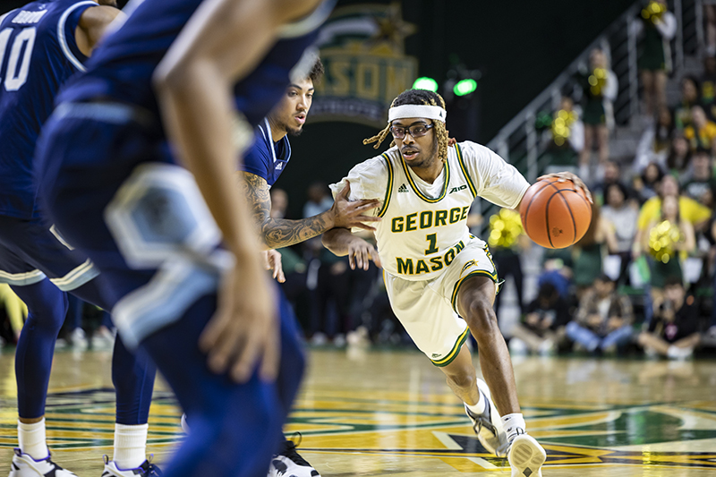 Ronald Polite III drives to the basket against Rhode Island