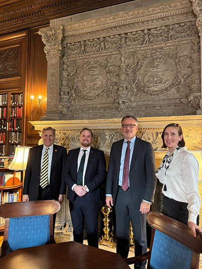 Dean Ozerdem and Professor Ozerdem at signing with John Hewko and Sarah Crawford of Rotary International
