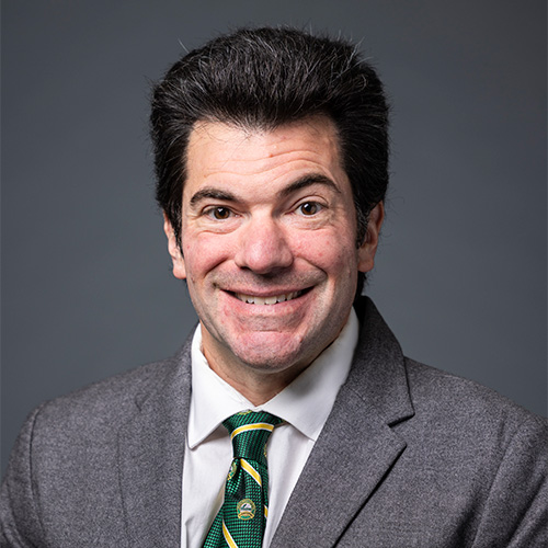 Kenneth Strazzeri wears a gray suit and green tie in his headshot