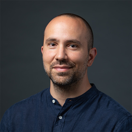 Evgenios wears a dark-blue shirt