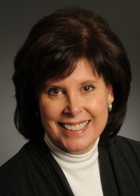 Mason Department of Health Administration and Policy Professor, PJ Maddox, smiles in a publicity portrait.